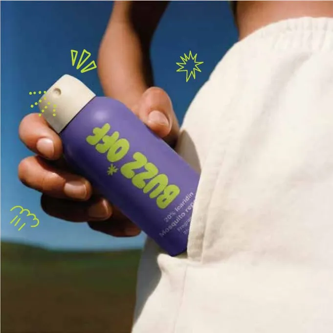 Hand pulling a purple BuzzOff can from a pocket